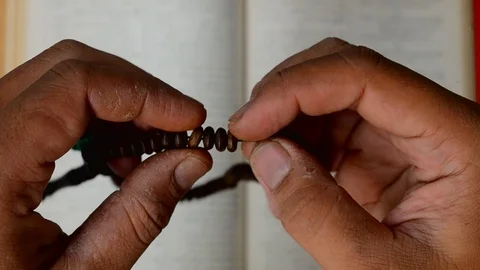 A man dizkr using tasbih Stock Footage 119740000