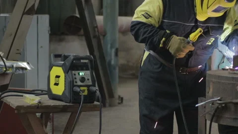 Man do welding and welding machine is in frame Stock Footage 88097007