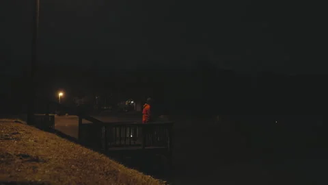 Man on dock at night Stock Footage 278199408