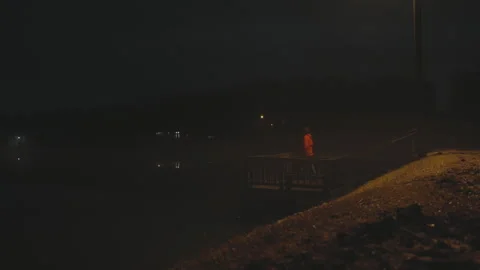 Man on dock at night opposite angle Stock Footage 278199488