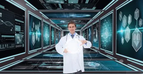 Man doctor interacting with 3D interfaces against background with medical 写真素材