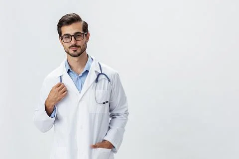 Man doctor in white coat and eyeglasses smile shows hand gestures signs on white Stock Photos