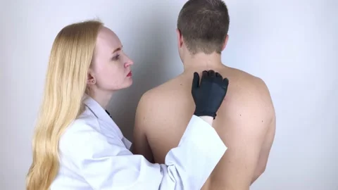 A man at the doctor's appointment with back pain. Treatment of spinal deformity  Stock Footage 148750902