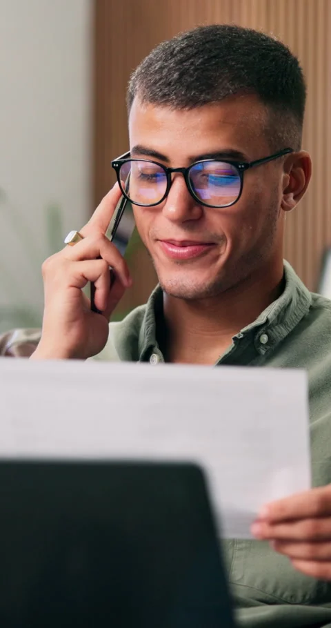 Man, documents and phone call with remote work from home with laptop, glasses Stock Footage 332926145