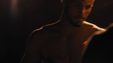 Man dodging attacks from opponent in a dark room Stock Footage 275084048