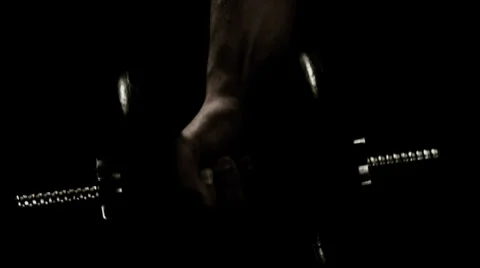 Man does arm curls and smiles afterwards Stock Footage 33831244