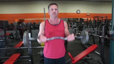 Man Does Bicep Curls At The Gym Video stock 61576806