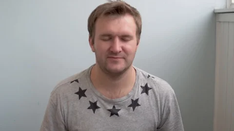 The man does a breathing gymnastics exercise to improve lung function Stock Footage 128479283