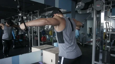 Man does cable crossover fly Stock Footage 85613520