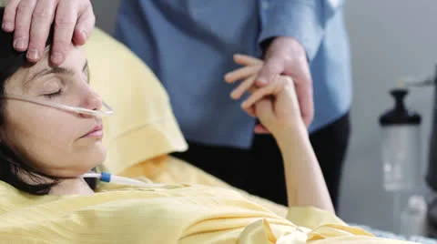 Man does caresses and holds the hand to his wife in hospital 库存影片 24616543