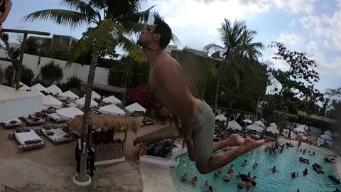 Man Does Double Backflip Flip Into Crowded Pool Club GoPro POV Stock Footage 144044656