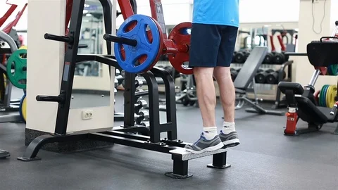 A man does an exercise on the calves of the legs Stock Footage 102249458
