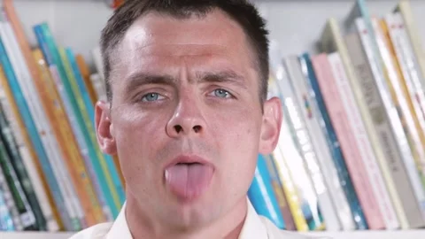 A man does an exercise with his tongue, biting him. The work speech therapist. Stock Footage 135032057