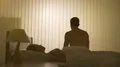The man does exercise near the woman in the bed 4k or 4k+ Resolution