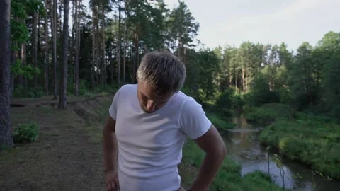 Man does exercise to warmup his head Stock Footage 168560114