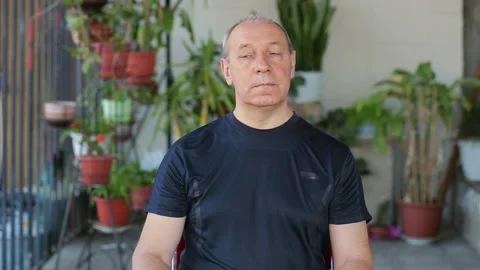 A man does exercises with his eyes in a diagonal motion. 库存影片 119995708