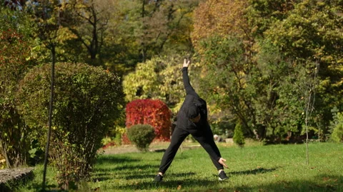 A man does exercises to warm up his muscles Stock Footage 229872568