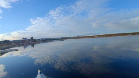 Man does extreme activity sailing on kayak on cold river Stock Footage 123411222