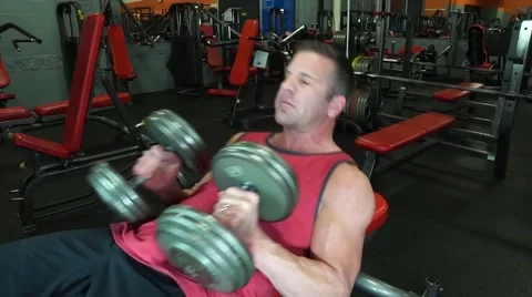 Man Does Flat Bench With Dumbbells Stock-Footage 61576724
