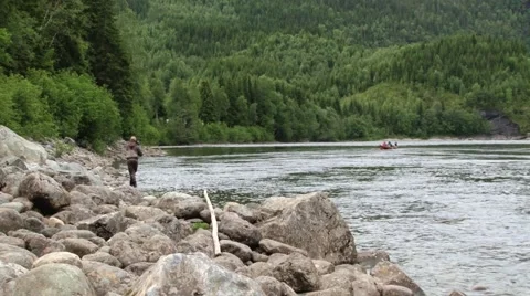 Man does fly fishing at the river in Sogndal, Norway. Stock Footage 59726632