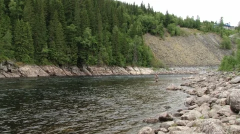 Man does fly fishing at the river in Sogndal, Norway. Video stock 59726726