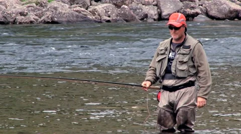 Man does fly fishing at the river in Sogndal, Norway. Stock Footage 59726919
