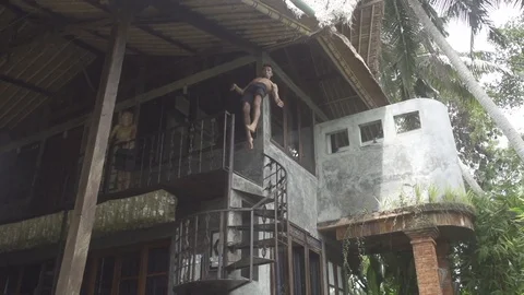 Man does Gainer From Balcony into Pool Slow Motion Stock Footage 106783691