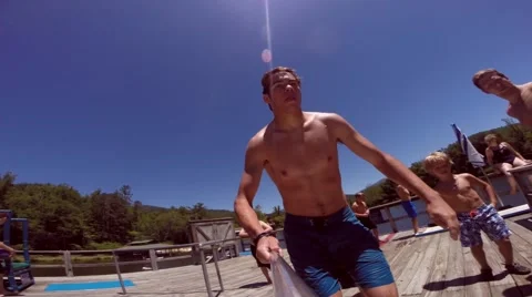 Man does a gainer into a lake Video stock 68559051