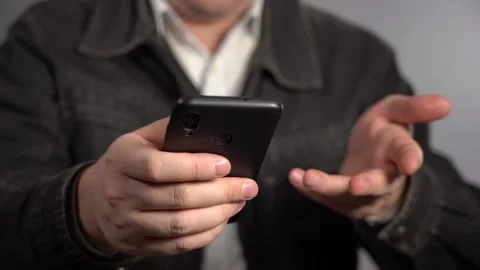A Man Does His Small Business From A Smartphone. Stock Footage 148140498