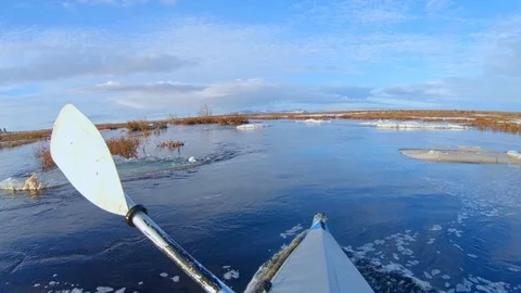 Man does hobby sailing on foldboat against northern nature Stock Footage 123863487