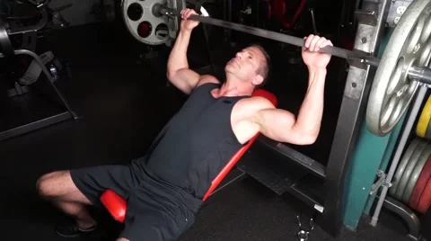 Man Does Incline Dumbbell Press With Weights Stock-Footage 61576732