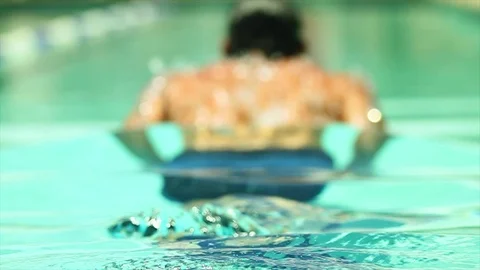 Man does laps in a pool. Butterfly stroke Stock Footage 106882880