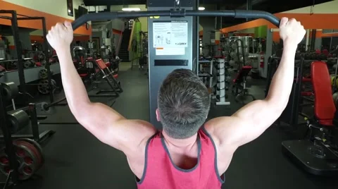 Man Does Lat Pulldowns At The Gym Stock Footage 61576742