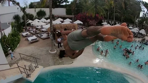 Man Does Layout Twisting Flip Into Crowded Pool Club GoPro POV Stock Footage 144044300