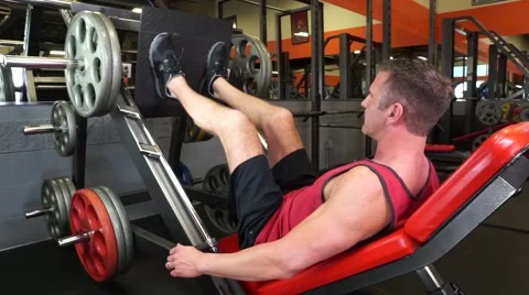 Man Does Leg Press At The Gym Video stock 61576786