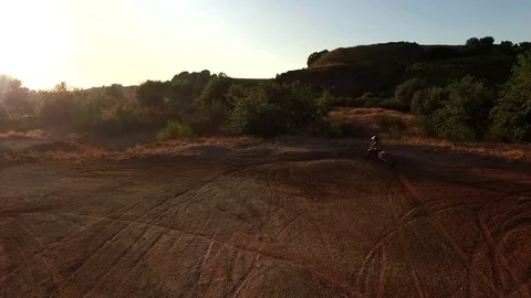 A man does motorally at sunset. About extreme sports, adrenaline, dust Stock Footage 70957000