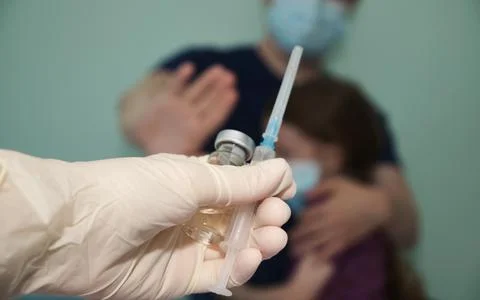 Man does not want to put the vaccine to his child, prohibiting hand sign Stock Photos