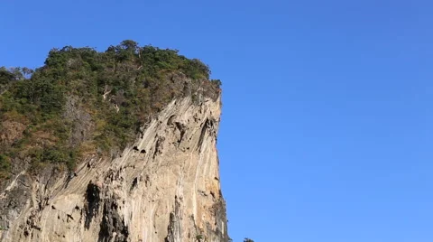 Man does parachute jump from cliff Stock Footage 47928186