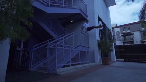 Man Does Parkour Vault Over Stair Railing Stock Footage 50481581