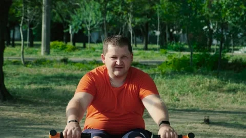 Man does physical exercise on sports ground Stock Footage 138817769
