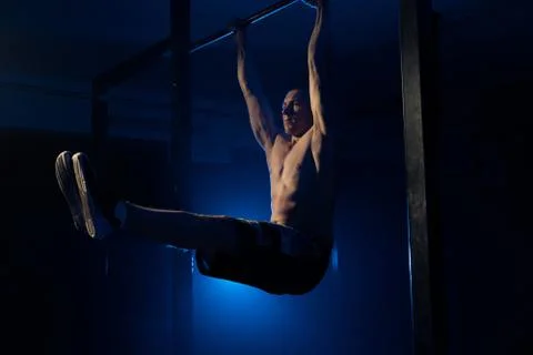 The man does pull-ups on the crossbar. Health. sport Stock Photos