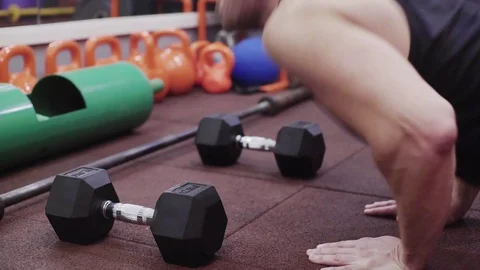 The man does push-ups from the last forces in the gym Video stock 123114204