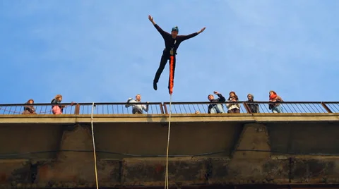 Man does somersaults in a jump from the bridge Stock Footage 37220765