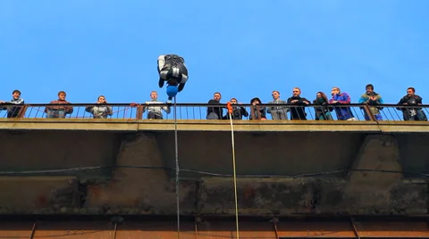 Man does somersaults in a jump from the bridge Stock Footage 37220889
