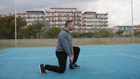 Man Does Squat Lunges Stability Exercise... | Stock Video | Pond5