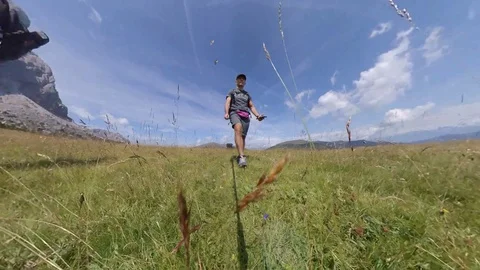 A Man does Trek on an open wide vale between Alps, vr360 effects Stock Footage 114423847