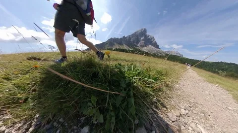 A Man does Trek on an open wide vale between Alps, backlight vr360 effects Stock Footage 114423877