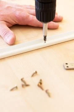 The man does the work of assembling furniture Stock Photos