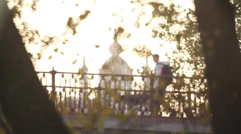 A man with a dog walks on the bridge,  domes of the church Stock-Footage 44893422