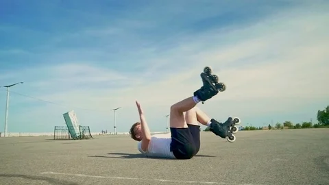 Man doing 360 jump on skates and fell Stock Footage 125317710